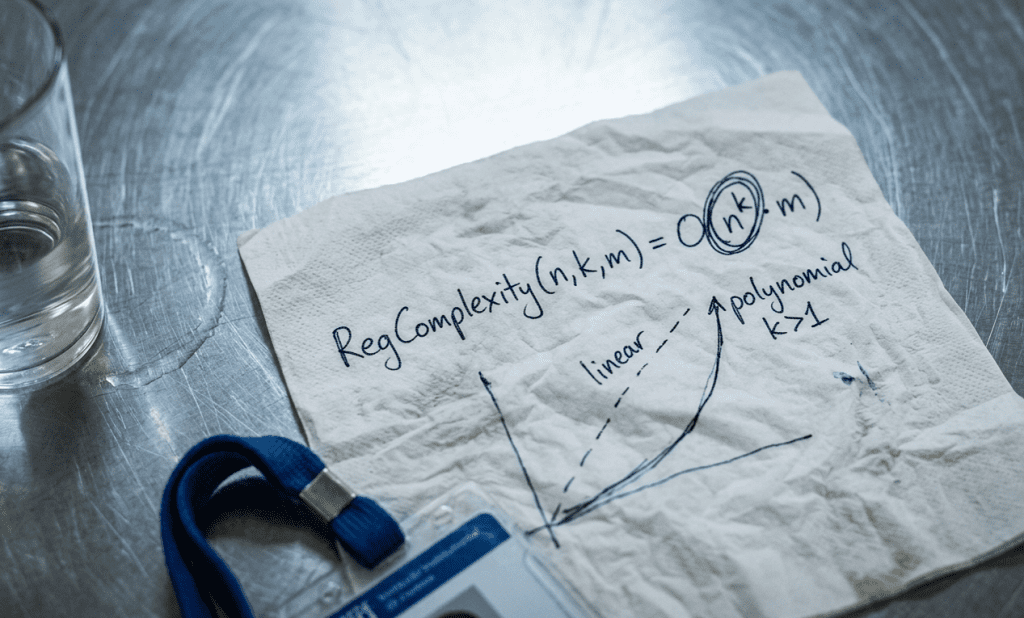 Hastily written formula on a canteen napkin showing polynomial complexity growth in cross-border tokenized securities compliance