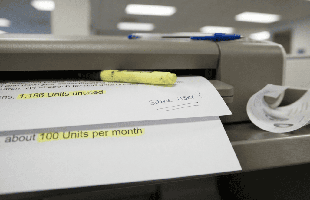 Two printed pages highlighted side by side showing conflicting oracle usage metering conversions